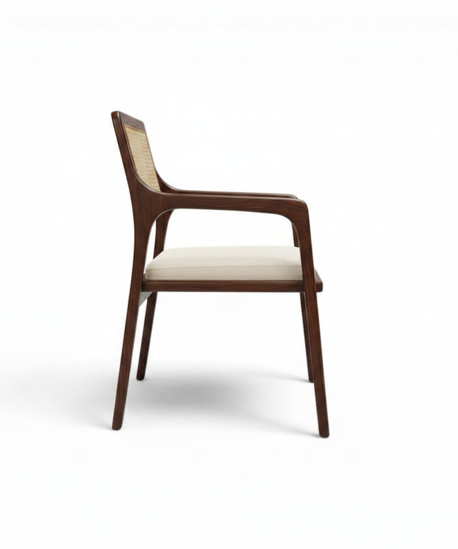 Gharnish Vanya Teakwood Cane Chair with a rich brown finish and natural cane backrest and seat.